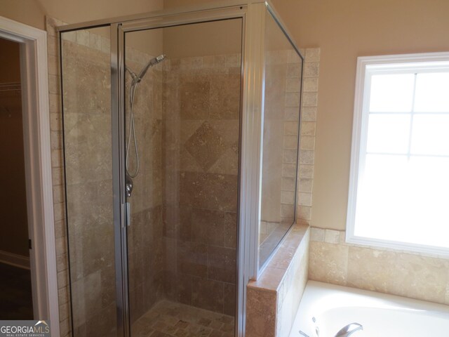 unfurnished bedroom featuring baseboards, wood finished floors, and a closet
