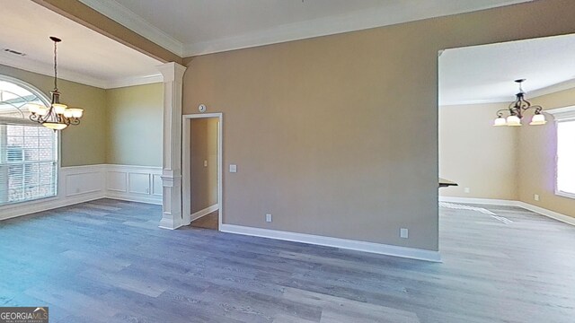 room details featuring crown molding, baseboards, a brick fireplace, and wood finished floors