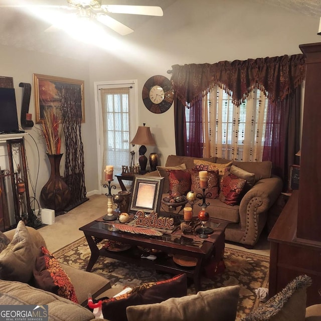 living area with carpet floors and a ceiling fan