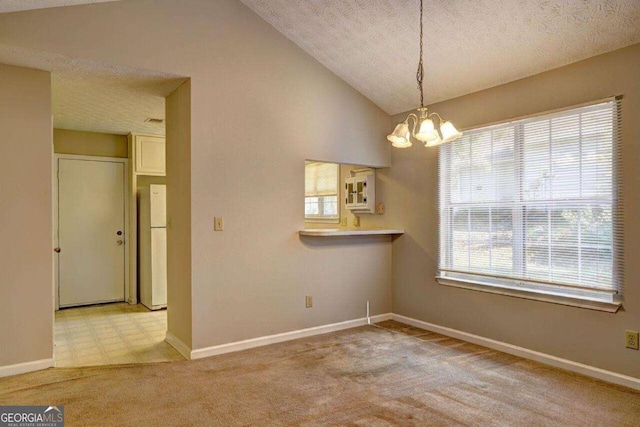 unfurnished dining area with light carpet, baseboards, lofted ceiling, a textured ceiling, and a chandelier