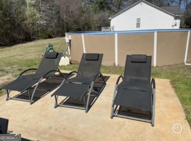 view of patio / terrace featuring a pool