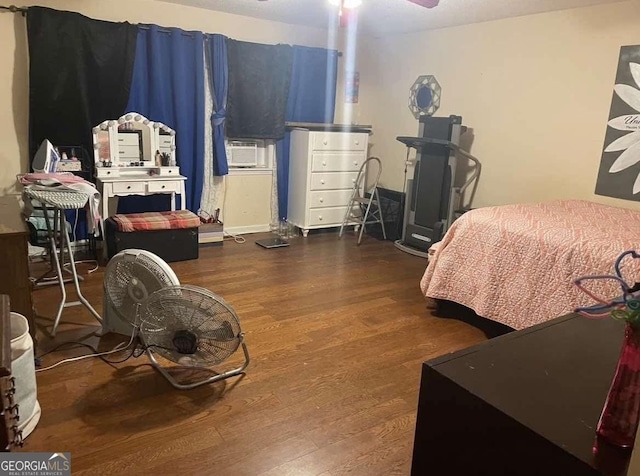 bedroom featuring wood finished floors