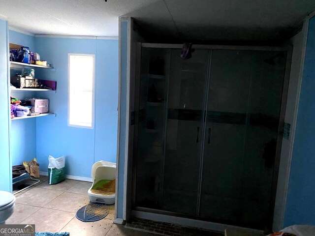 154 Buckhalter Rd, Savannah, GA 31405 - full bathroom featuring tile patterned flooring, baseboards, a shower stall, and toilet