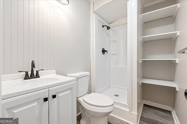 154 Buckhalter Rd, Savannah, GA 31405 - bathroom featuring toilet, a stall shower, wood finished floors, and vanity