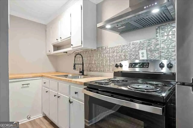 154 Buckhalter Rd, Savannah, GA 31405 - kitchen featuring a sink, white cabinets, wall chimney range hood, decorative backsplash, and black electric range oven