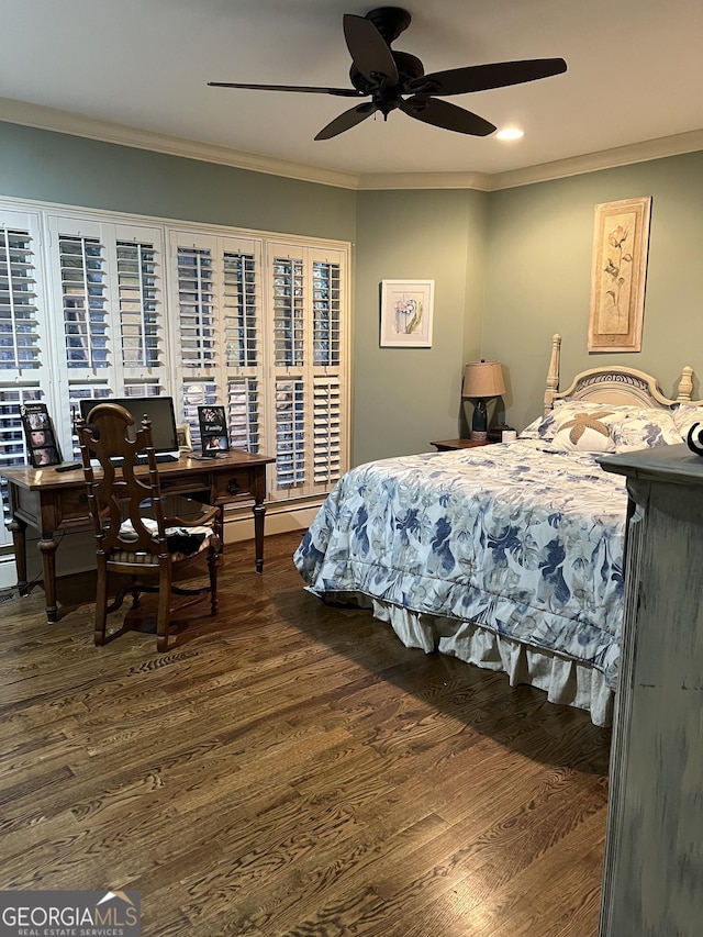 bedroom with a ceiling fan, ornamental molding, and wood finished floors