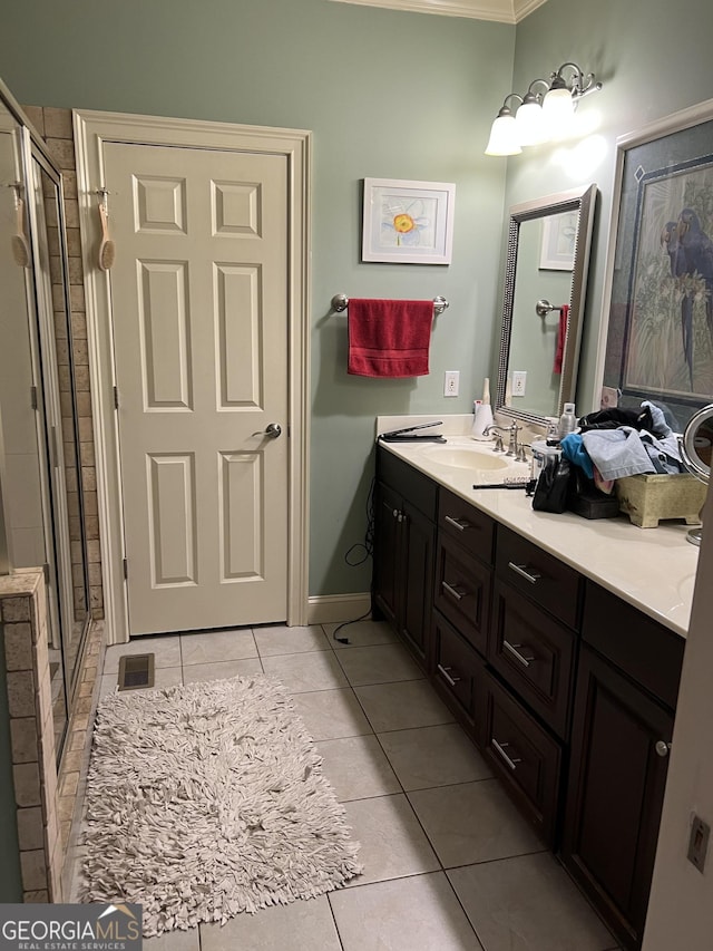 full bathroom with visible vents, ornamental molding, a stall shower, vanity, and tile patterned flooring