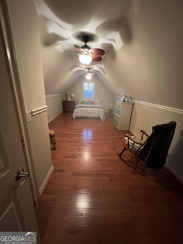 bonus room featuring vaulted ceiling, wood finished floors, and a ceiling fan