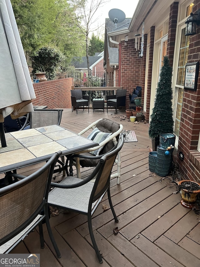 wooden deck with outdoor dining area