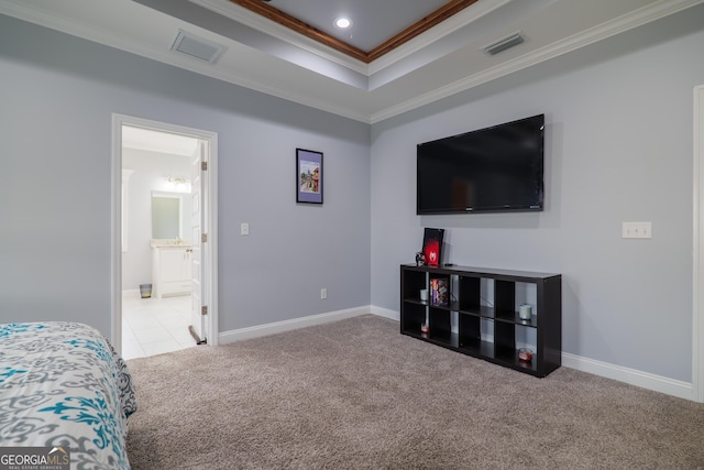 carpeted bedroom featuring ornamental molding, a raised ceiling, visible vents, and baseboards