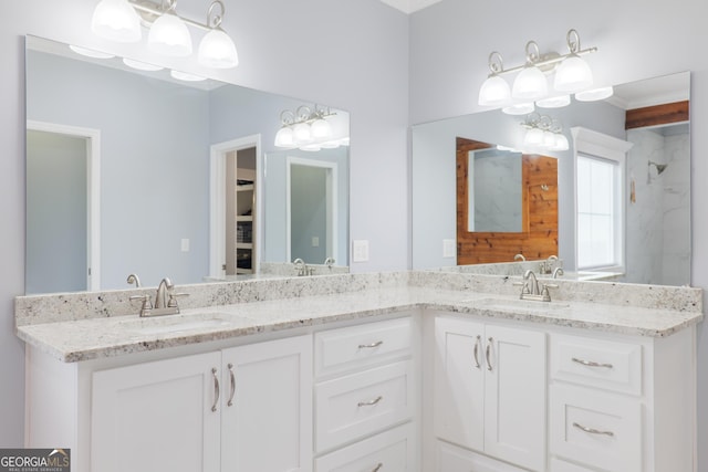 bathroom with double vanity and a sink