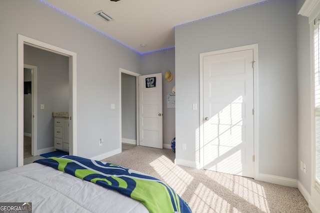 bedroom featuring carpet, visible vents, and baseboards