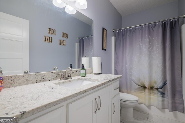 bathroom featuring curtained shower, marble finish floor, vanity, and toilet