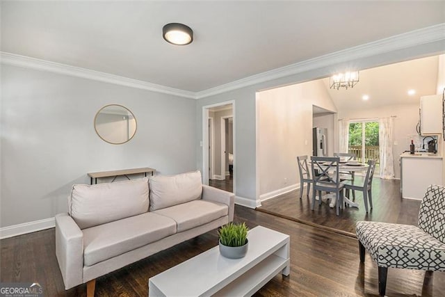 125 Warren St, Atlanta, GA 30317 - living area with a notable chandelier, baseboards, dark wood-style flooring, and ornamental molding