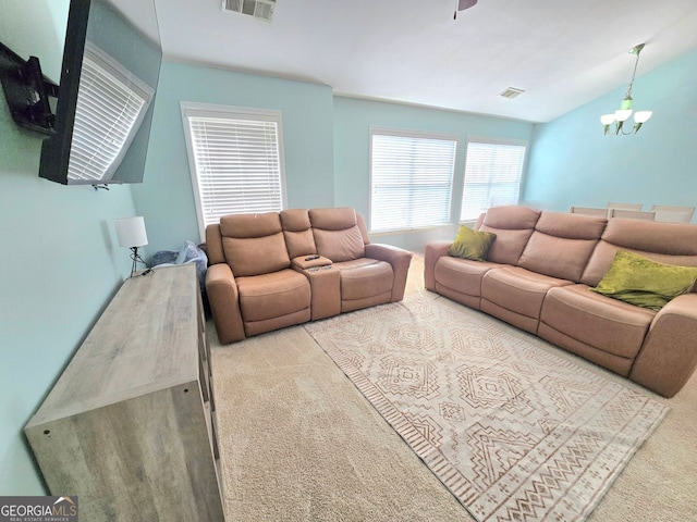 living room featuring light carpet, vaulted ceiling, visible vents, and baseboards