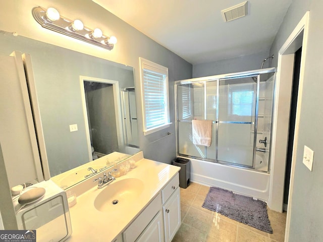 kitchen with visible vents, vaulted ceiling, black fridge, and carpet flooring