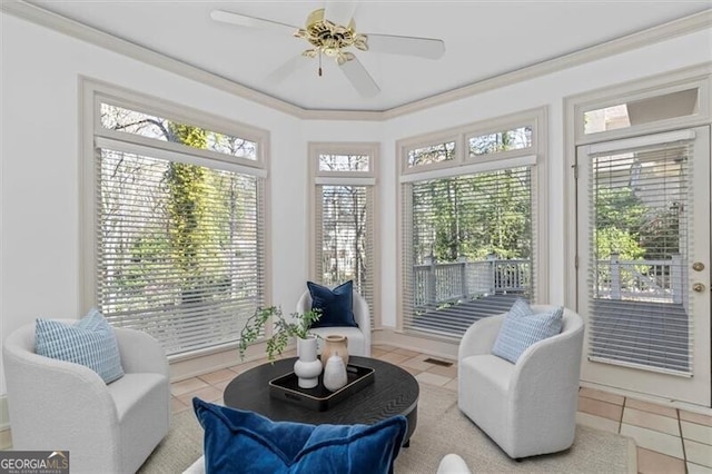 sunroom / solarium with a ceiling fan