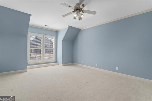 bonus room with a ceiling fan, baseboards, and carpet flooring