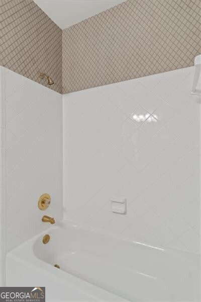 full bath featuring shower / tub combination