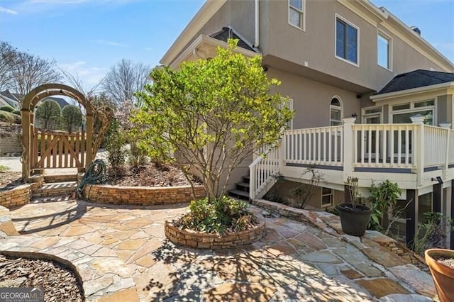 exterior space featuring a patio and stucco siding