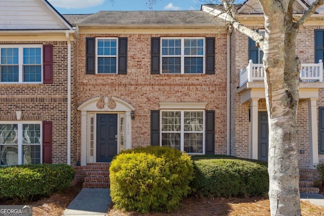 view of property with brick siding