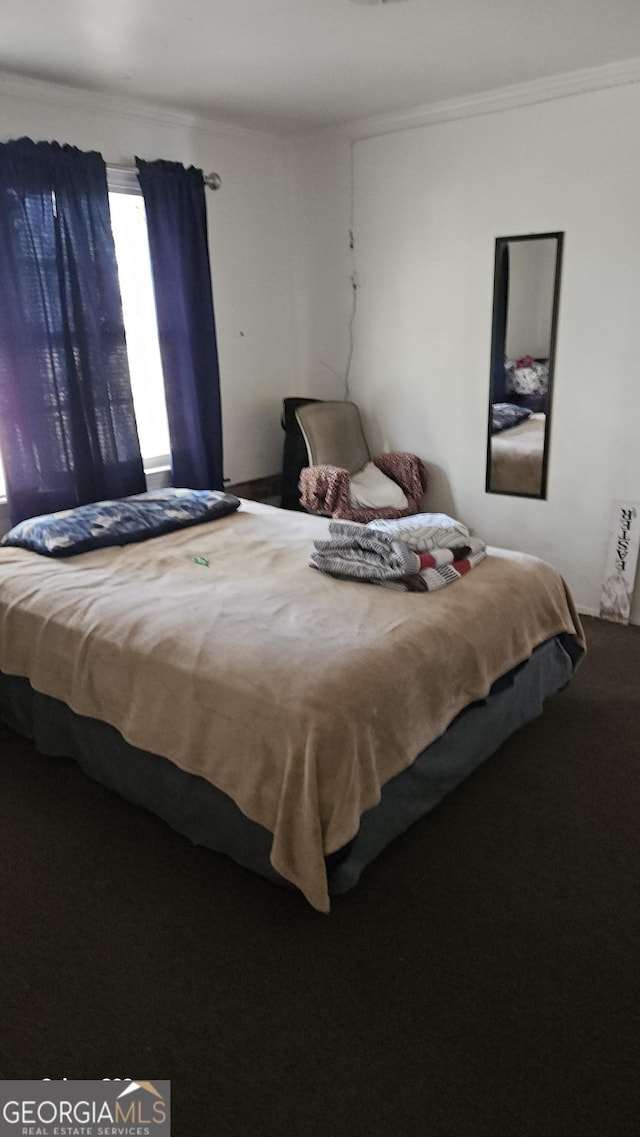 bedroom with crown molding