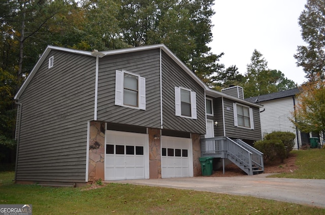 view of home's exterior with driveway, stone siding, a chimney, and an attached garage