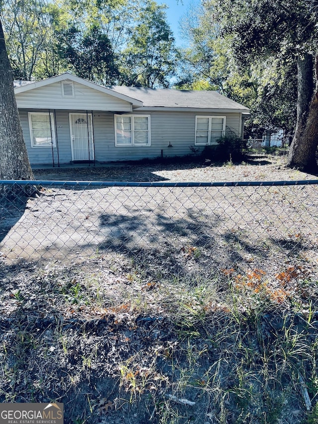 view of front of house featuring a fenced front yard and a porch