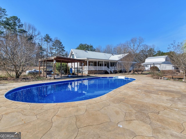 pool with a patio area