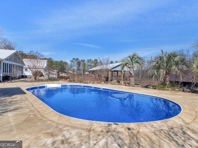 view of pool with a patio area and a fenced in pool