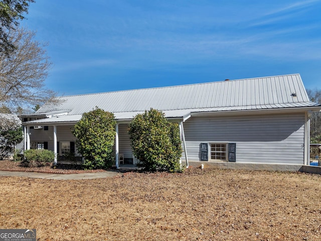 exterior space featuring metal roof