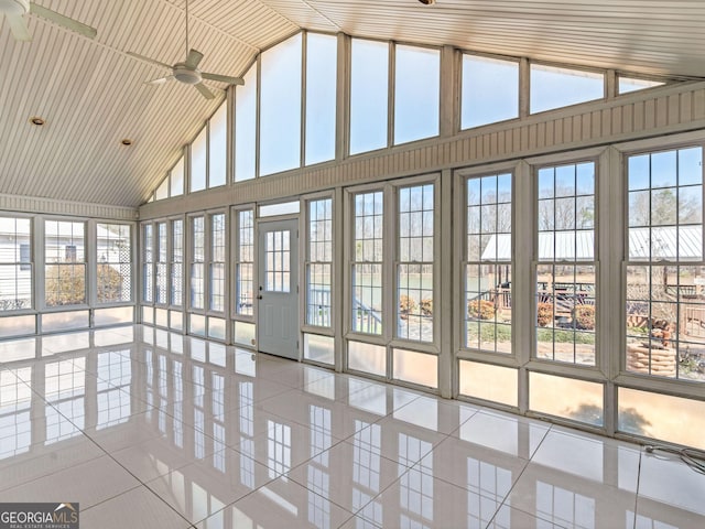 unfurnished sunroom with vaulted ceiling and a ceiling fan