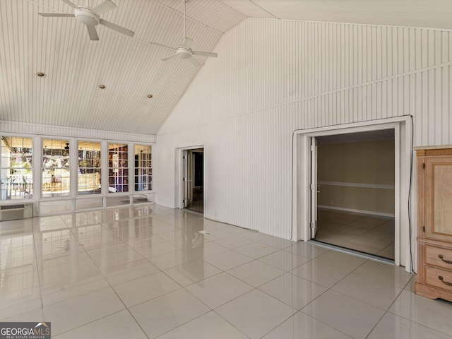 empty room featuring light tile patterned floors, ceiling fan, and high vaulted ceiling