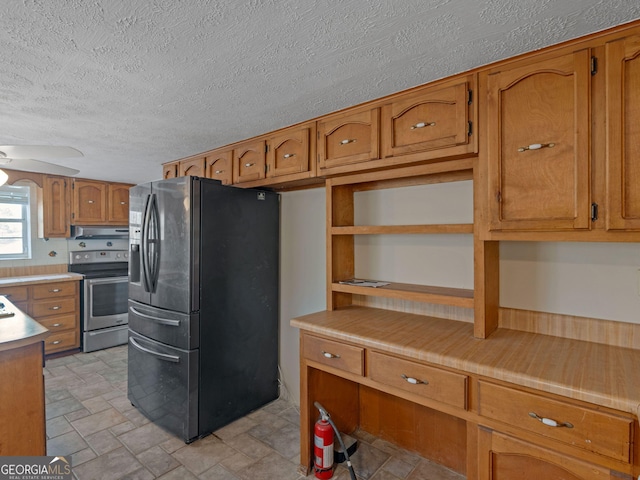 kitchen featuring brown cabinetry, ceiling fan, appliances with stainless steel finishes, under cabinet range hood, and open shelves