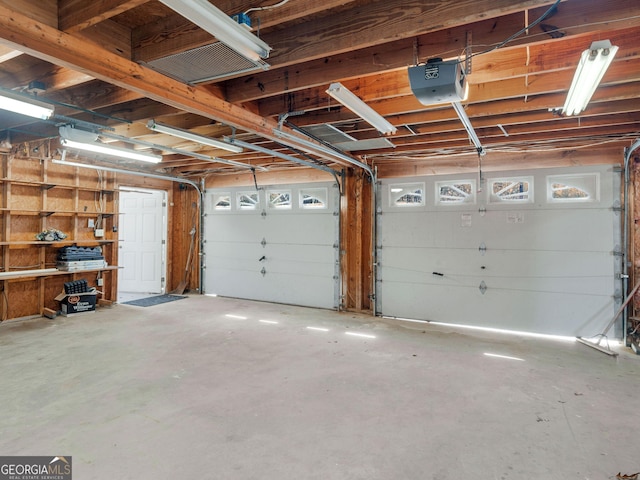 garage featuring a garage door opener