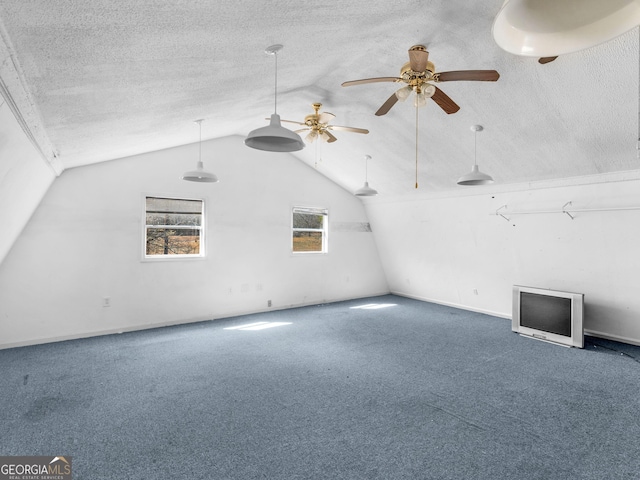 bonus room with carpet floors, vaulted ceiling, and a textured ceiling