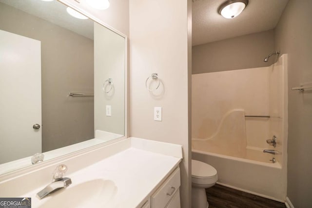 2505 Broad St W Unit 713, Athens, GA 30606 - bathroom featuring vanity, wood finished floors, shower / washtub combination, and a textured ceiling