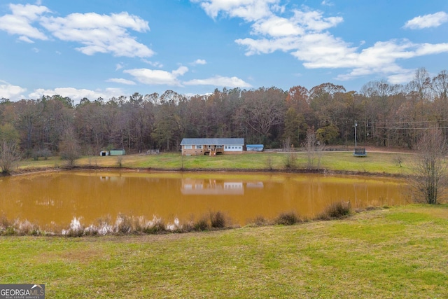 property view of water featuring a wooded view