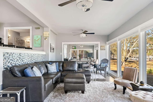 living area with ceiling fan and wood finished floors