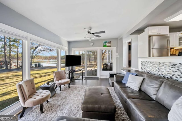 living room featuring a ceiling fan