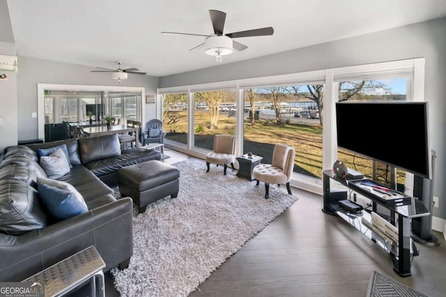 living area featuring ceiling fan and wood finished floors