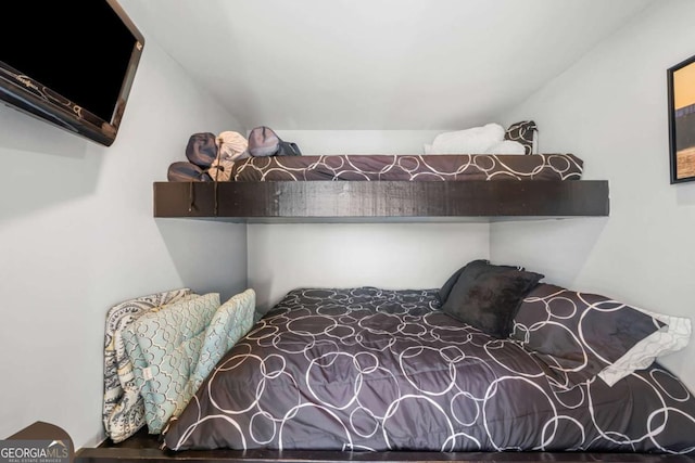 bedroom with lofted ceiling