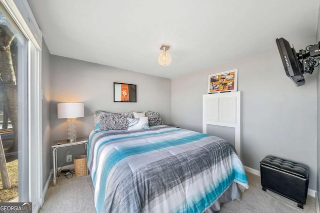 carpeted bedroom with baseboards