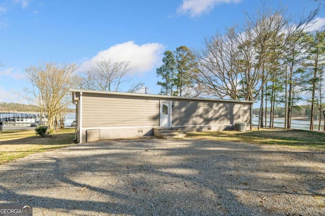 view of home's exterior featuring crawl space and entry steps