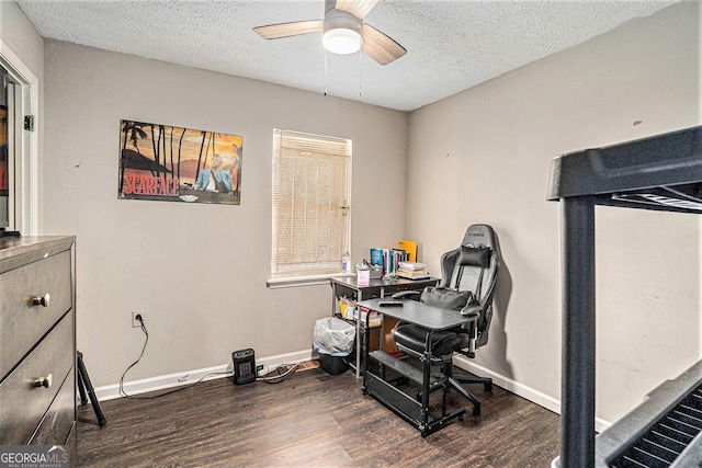 miscellaneous room with a textured ceiling, wood finished floors, a ceiling fan, and baseboards