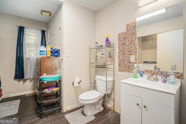 bathroom featuring toilet, baseboards, and wood finished floors