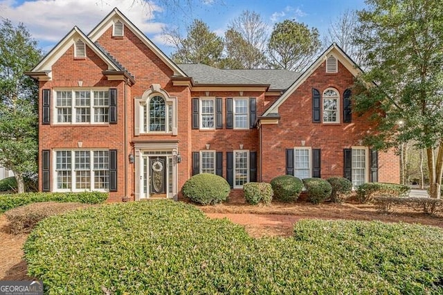 view of front facade featuring brick siding