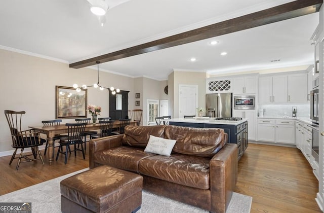 living room featuring recessed lighting, beamed ceiling, light wood-style flooring, and crown molding