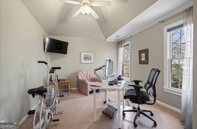 office area featuring a wealth of natural light, lofted ceiling, and light colored carpet