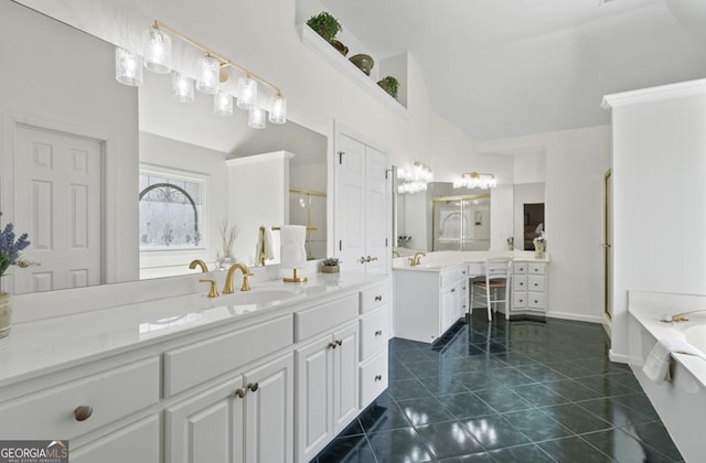 full bathroom featuring tile patterned flooring, a garden tub, two vanities, a stall shower, and a sink